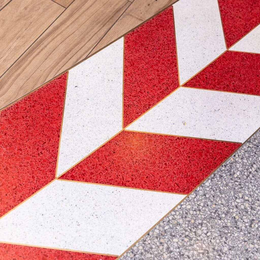 Close-up of red stitching tile along the Target Field's Truly on Deck lounge