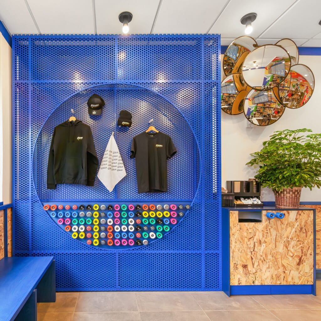 Egg on a Roll skateboard wheel wall with merchandise hung on wall