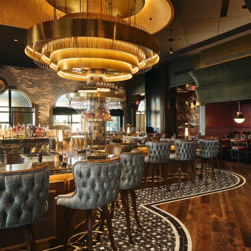 Metal frame circling custom light fixture at 1933 Lounge